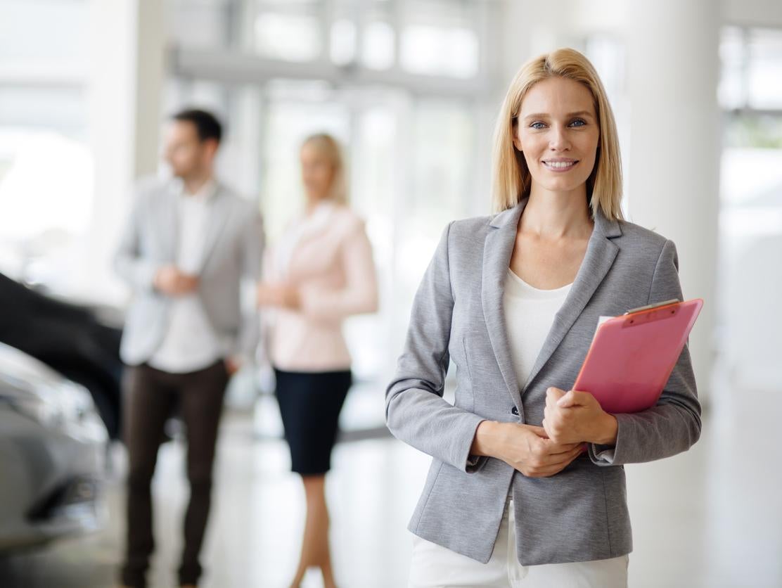 image of a woman holding a clipboard